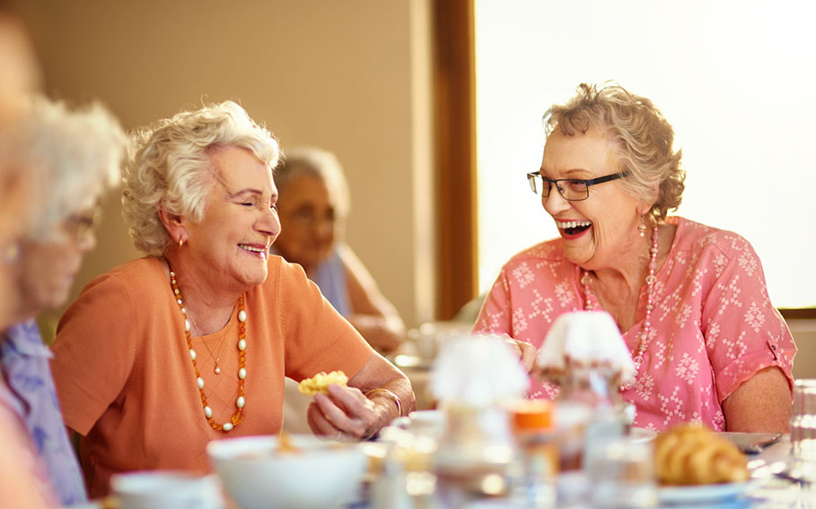 Seniors enjoying social dining at Charter Senior Living of Jackson, TN.