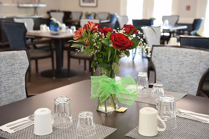 dining table set with floral centerpiece