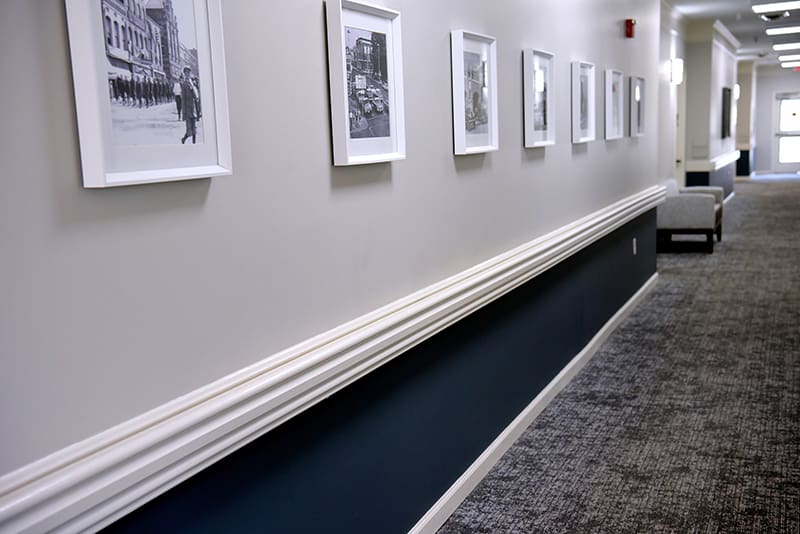 hallway of framed photographs