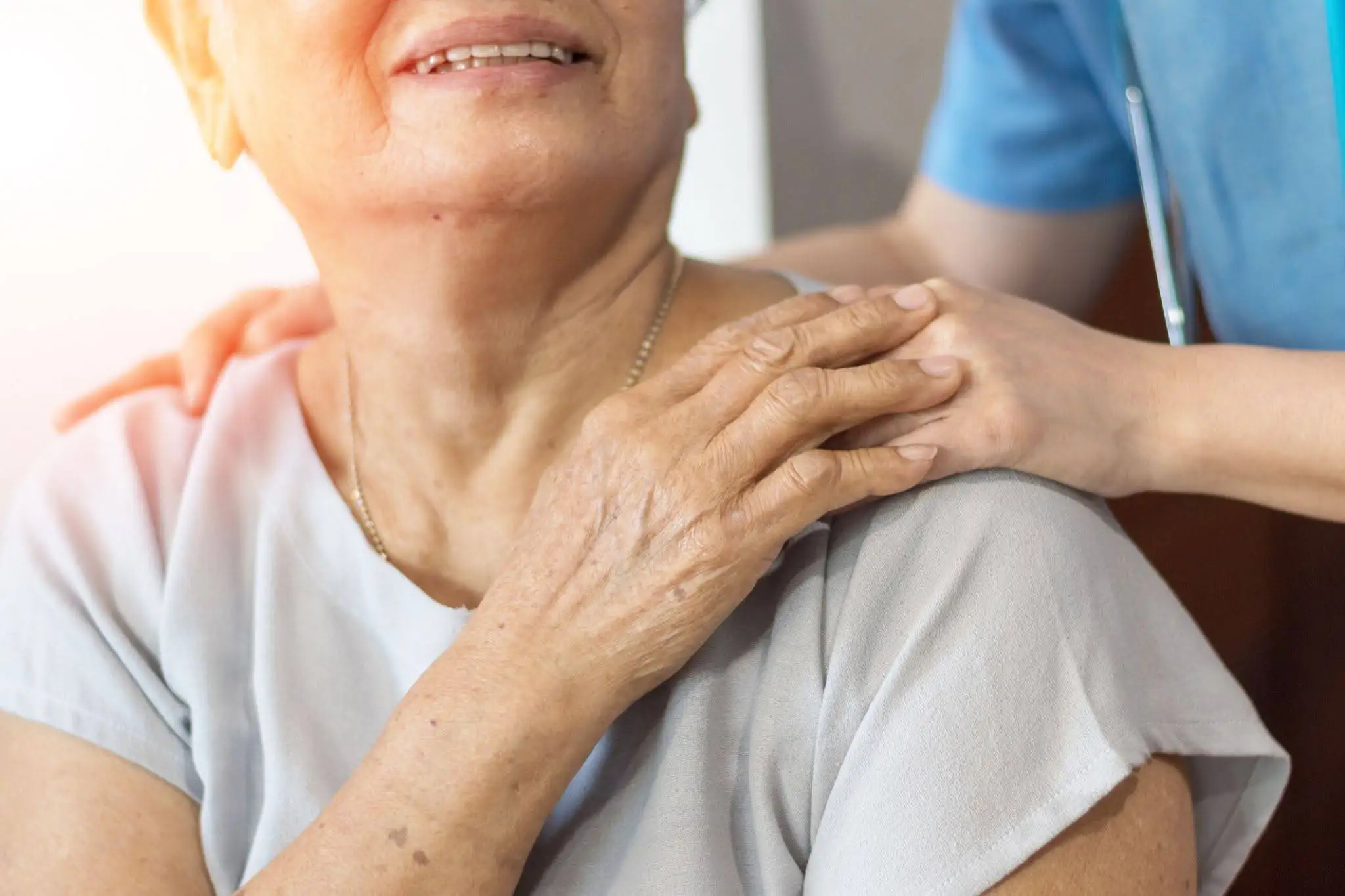Charter Emergency Placement Featured Image Caregiver resting her hand on the shoulder of a senior woman